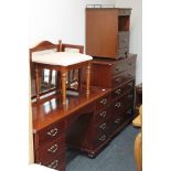 A contemporary Mcdonagh five piece mahogany bedroom suite comprising of five drawer chest,