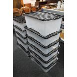 Eleven plastic storage crates with lids