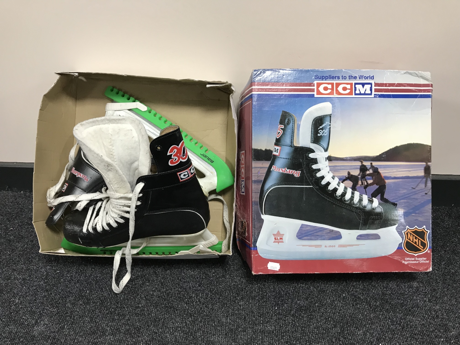 A pair of boxed CCM ice skates