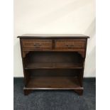 A set of inlaid mahogany open bookshelves fitted two drawers