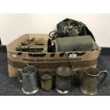 A box of assorted clock parts, cameras, tankards,