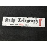 A hand painted "Daily Telegraph" advertisement on board