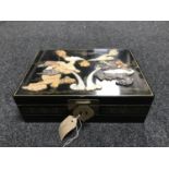 An Oriental black lacquered jewellery box