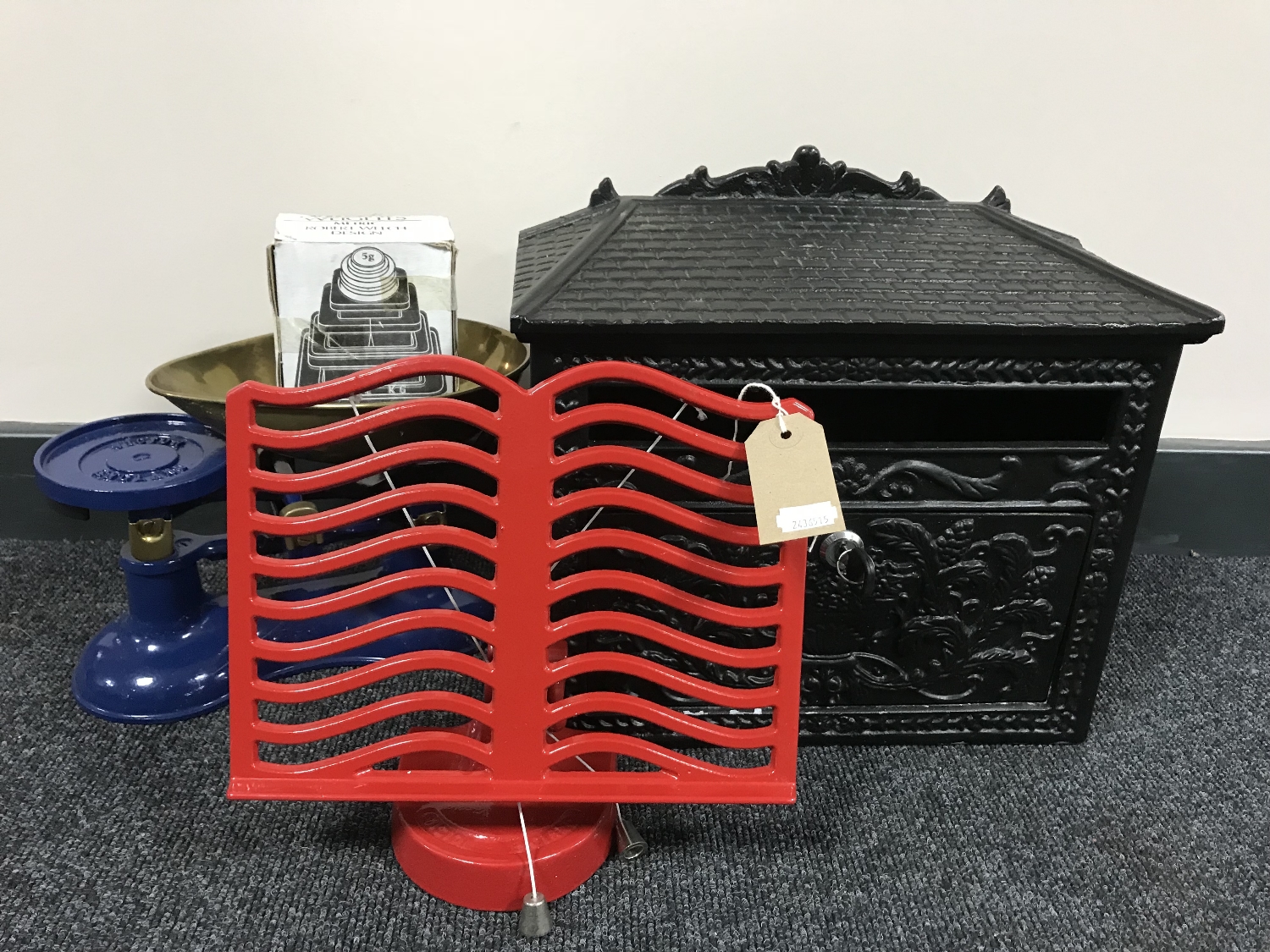 A set of Victor kitchen scales with weights together with a metal menu stand and a metal postbox