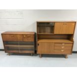 A teak sliding glass door bureau bookcase together with a teak effect cocktail sideboard