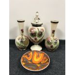 A Poole pottery bowl and an early 20th century hand painted vase trio