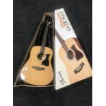 A boxed Ibanez acoustic guitar in carry bag together with two wall canvases;