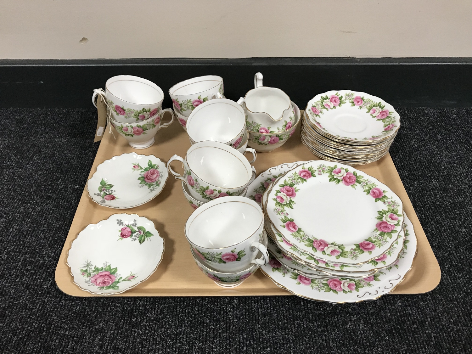 A tray of thirty six pieces of Colclough pink rose tea china and a pair of Adderley plates