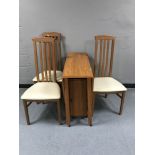 A teak dropleaf storage table together with a set of three high backed Caxton chairs