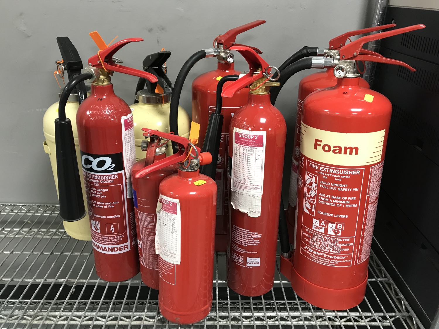 NIne assorted fire extinguishers