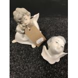 A Lladro figure of a seated cherub together with a Lladro cherub's head