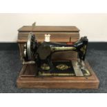 A mahogany cased Singer hand sewing machine