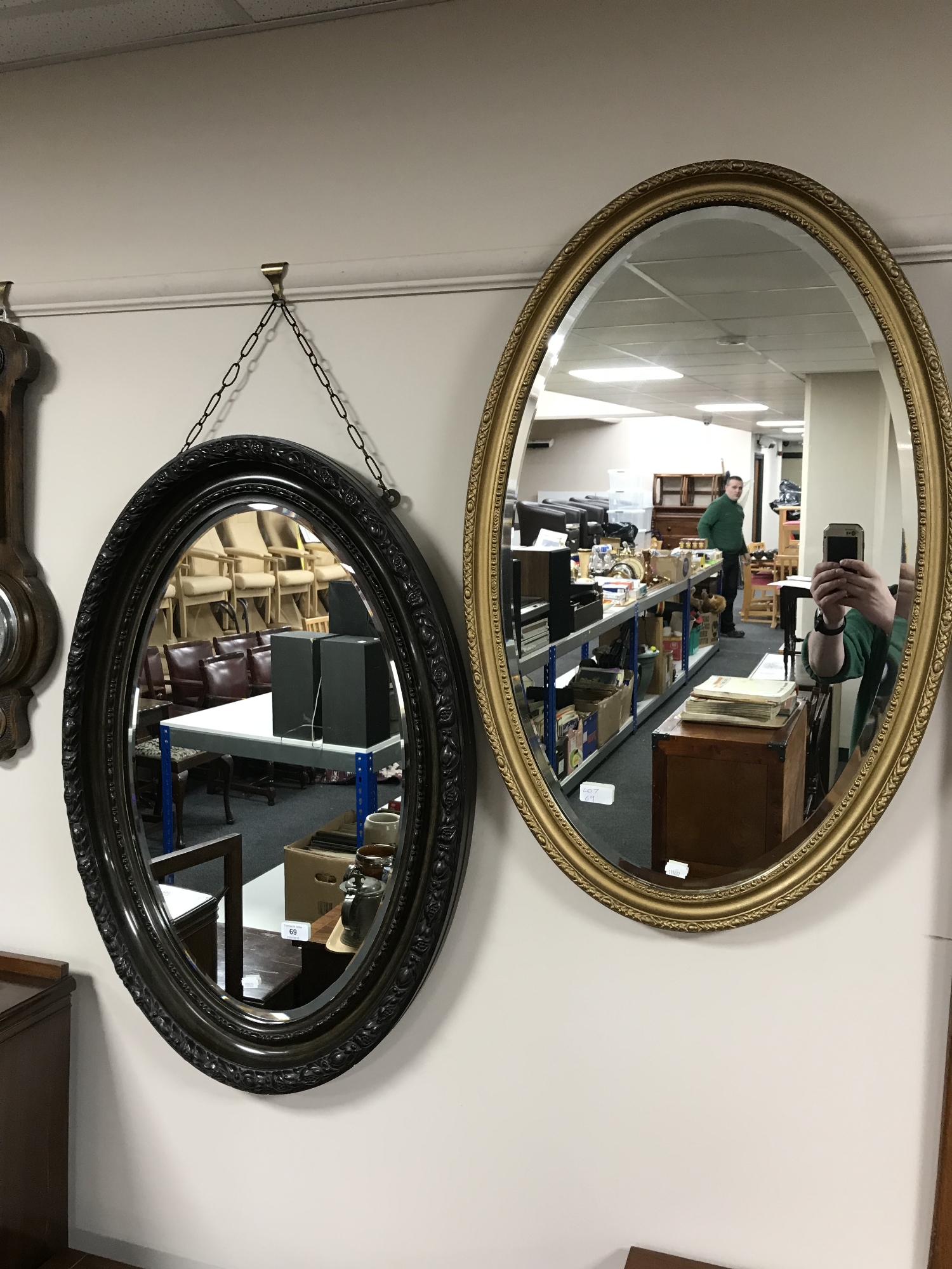 Two early 20th century oval framed mirrors