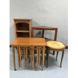 A set of teak open shelves together with a teak table,