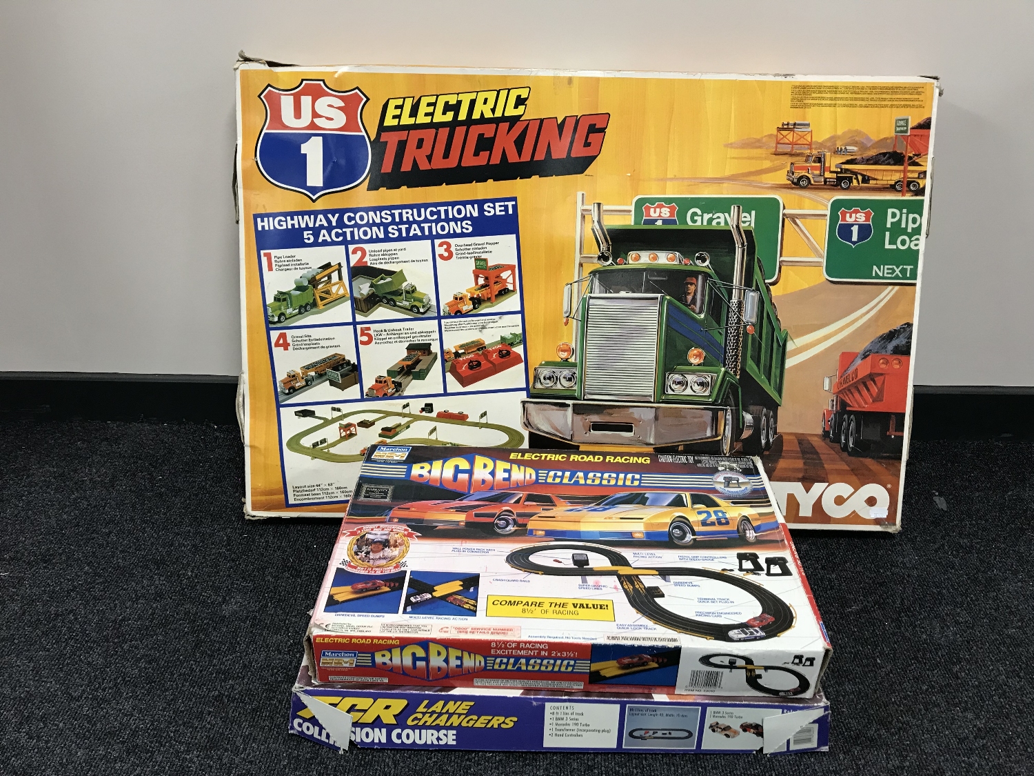 Three boxed electric racing sets - US 1 electric trucking,