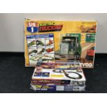 Three boxed electric racing sets - US 1 electric trucking,