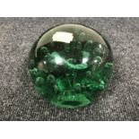 A large antique green glass dump with bubble inclusions