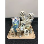 A tray of a pair of Staffordshire style dogs, two Arthur Wood china piggy banks,