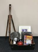 A box of artist's easel, Russian style hat, soda syphon, Beatles book,