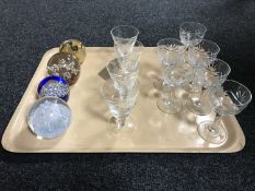 A tray of two sets of glasses and four paperweights including Caithness Congratulations