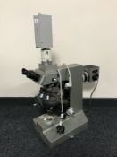 A Japanese Olympus Vanox laboratory microscope and accessories