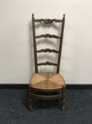 An early 20th century high back oak chair