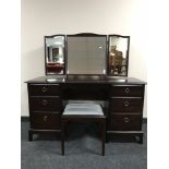 A Stag Minstrel dressing table with triple mirror and stool