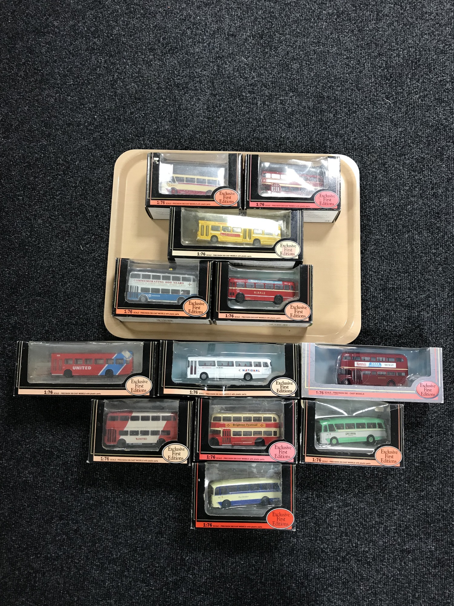 A tray of twelve boxed Exclusive First Edition die cast buses,