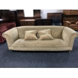 A Chesterfield style settee with cushions