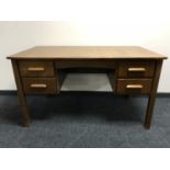 A mid 20th century oak twin pedestal desk