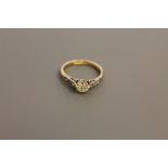 An 18ct gold solitaire diamond ring, approximately 0.5ct, size J, set with diamond shoulders.