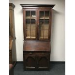 An Edwardian oak bureau bookcase