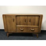 A mid 20th century teak G Plan cocktail sideboard