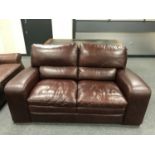 A Barker & Stonehouse brown leather two seater settee,