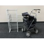 A shopping trolley and two shoe racks