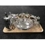A tray of silver plated pieces - swing handled basket, part tea services, gravy boat,