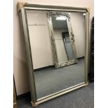 A contemporary framed mirror,