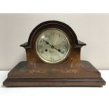 An inlaid mahogany 8 day mantel clock with silvered dial