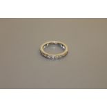 A platinum and diamond eternity ring CONDITION REPORT: The ring is size N/O.