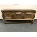 A continental oak triple door low sideboard, width 181 cm.