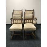 A set of four antique French oak dining chairs
