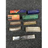 A box of assorted harmonicas by Hohner,