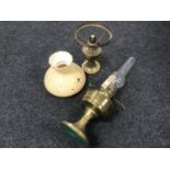 Two brass oil lamps and an odd glass shade