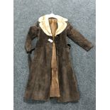 A mid twentieth century fur lined brown suede lady's coat.