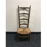 An early 20th century high back oak chair