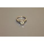 An 18ct gold solitaire diamond ring, the principal stone weighing an estimated 1.