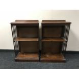 A Victorian inlaid mahogany revolving bookcase converted into two sets of shelves
