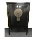 A Chinese lacquered double door cabinet CONDITION REPORT: 175cm high, 109cm wide,