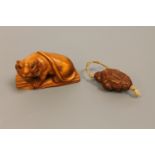 A Japanese carved wood netsuke of a tiger,