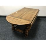 A Chapman's Siesta oak drop leaf table